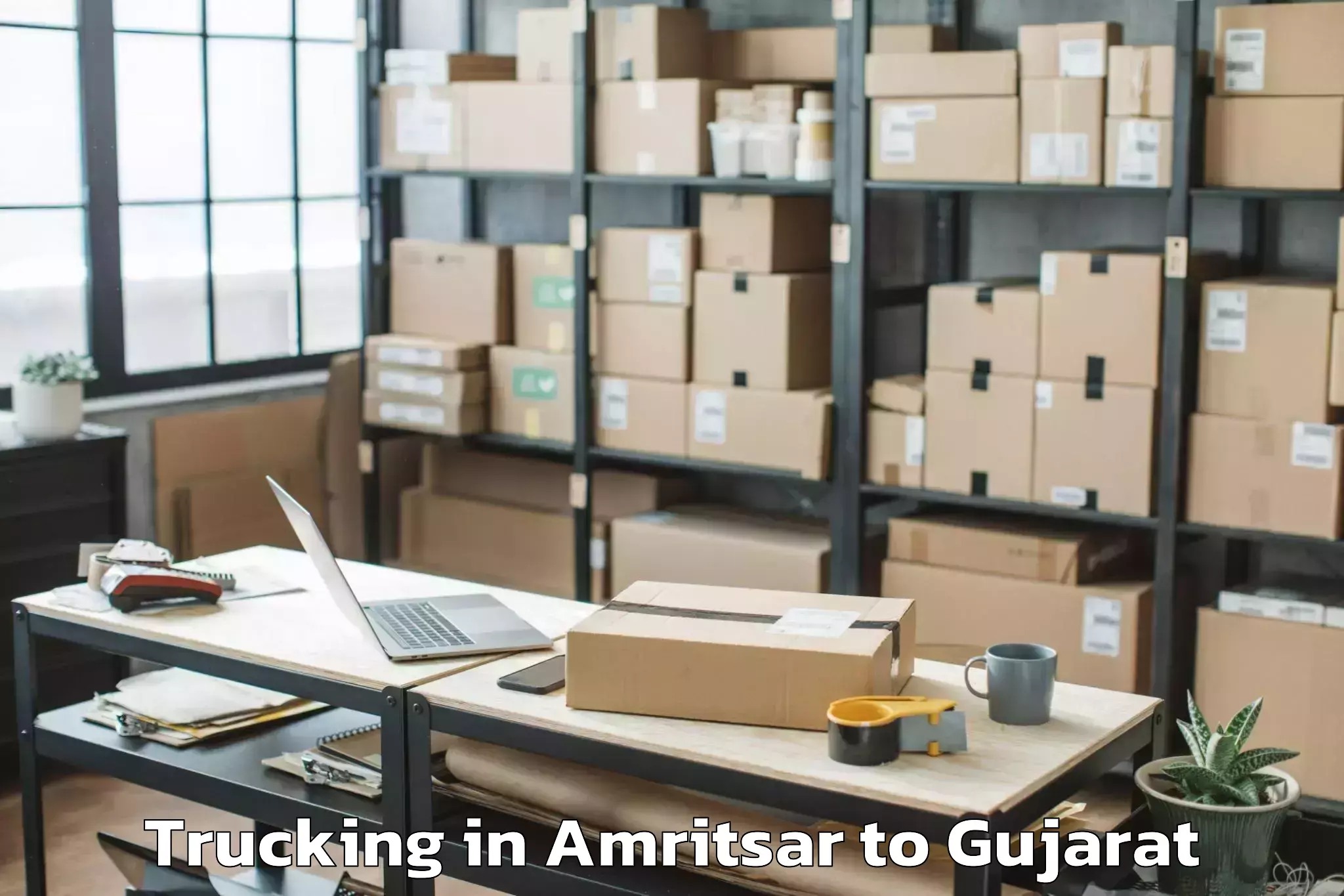 Book Amritsar to Godhra Trucking Online